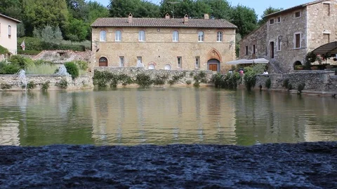 Water flow in the thermal bath in the square of Bagno Vignoni, Siena Stock Footage 99154753