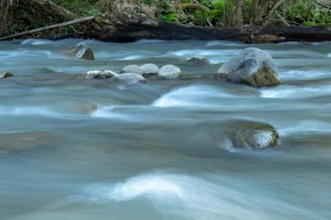 The water flow through the rocks in a stream at Wang Nan Pua , Nan in Thailan Stock Photos