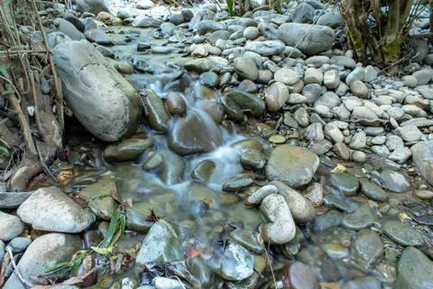 The water flow through the rocks in a stream at Wang Nan Pua , Nan in Thailan Stock Photos