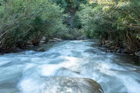 The water flow through the rocks in a stream at Wang Nan Pua , Nan in Thailan Stock Photos