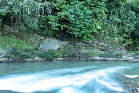 The water flow through the rocks in a stream at Wang Nan Pua , Nan in Thailan Stock Photos