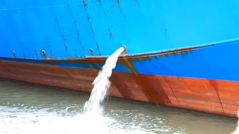 Water flow through ship pipe hole Stock Footage 94983410