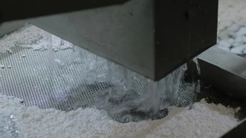 Water flow with white plastic granules, pellets, recycling machine: filtration Stock Footage 341852038
