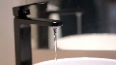 Water flowing from a bathroom pipe tap faucet Video stock 201088697