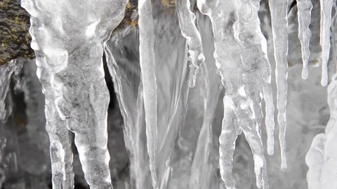 Water Flowing Behind Icicles Stock Footage 102867771
