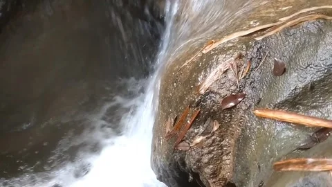 Water flowing between rocks Stock Footage 333157710