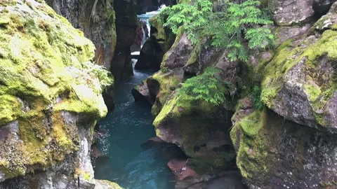 Water flowing between rocks - slow motion Видео 220158410
