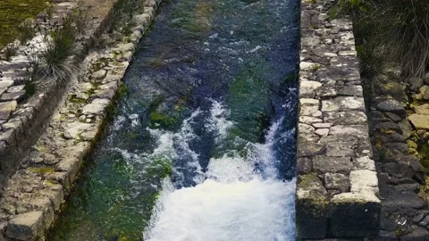 Water Flowing Between Stone Borders Stock Footage 237996816