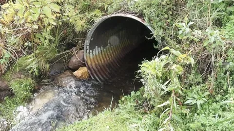Water flowing in to culvert Stock Footage 214161929