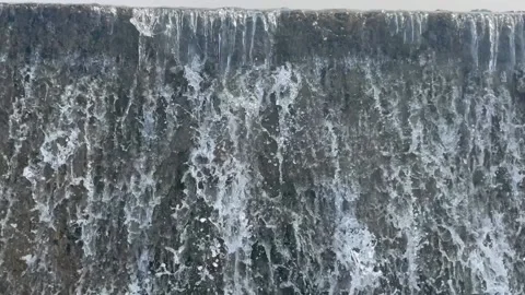 Water flowing from the dam Stock Footage 166166213