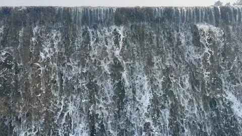 Water flowing from the dam Stock Footage 166310672