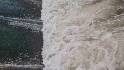 Water flowing from a dam Stock Footage 255973982