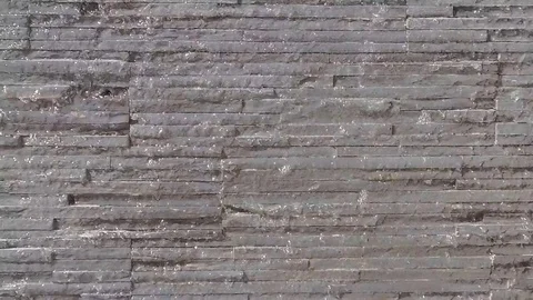 Water flowing down a brick wall. Slow motion Stock Footage 84704537