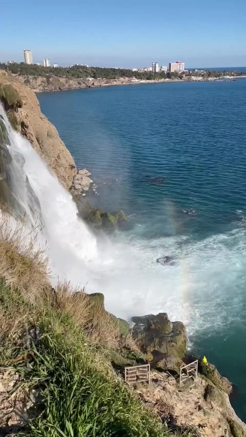 Water flowing down from a cliff in a rapid stream - waterfall coast of Antalya 스톡 동영상 283757115