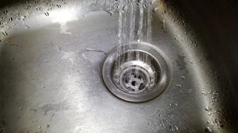 Water flowing down the drain Stock Footage 53764247