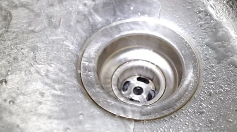 Water flowing down the drain Stock Footage 53764345