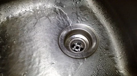 Water flowing down the drain Stock Footage 53764440