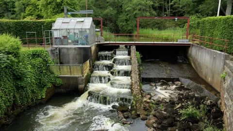 Water flowing down fish ladder at small hydroelectric power plant Stock Footage 337733468