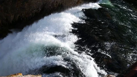Water flowing down the head of Yellowstone Falls in Yellowstone National Park Stock Footage 122689103