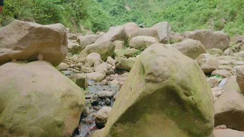 Water is flowing down the rocks from the mountain springs Stock Footage 314676840