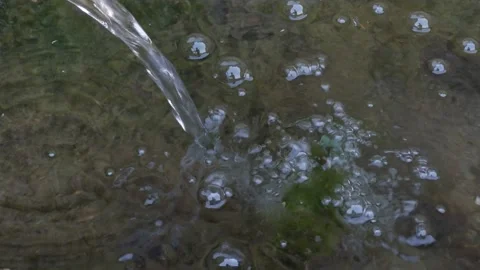 Water flowing down from the source Stock Footage 151894338