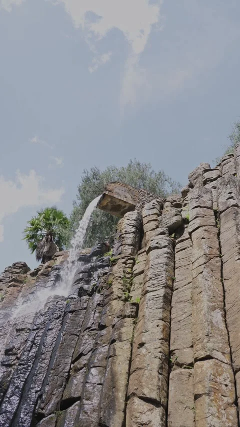 Water flowing down the spectacular basaltic prisms of santa maria regla Stock Footage 342041839