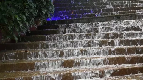 Water flowing down steps water feature Stock Footage 76563358