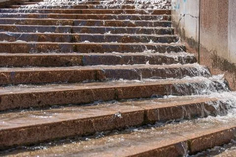 Water Flowing Down Stone Steps With Moss And Algae Stock Photos