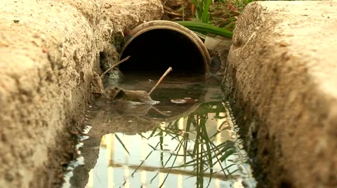 Water flowing down a storm drain 2 Stock Footage 980409