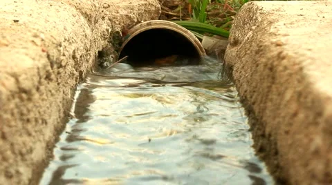 Water flowing down a storm drain 3 Stock Footage 980566