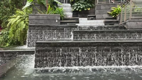 Water Flowing down in Terraced Stone Pond with Indoor Garden 스톡 동영상 342536466