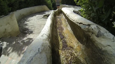 Water flowing down through gutter which doubles as hand rail Stock Footage 30568875