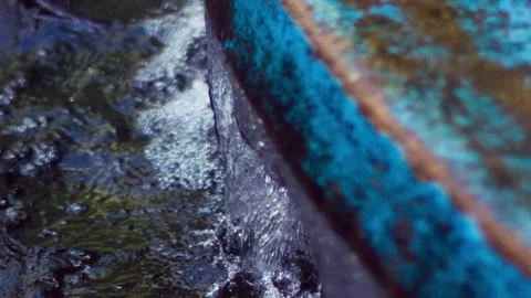 WATER FLOWING DOWN WATER FEATURE D Video stock 229613442