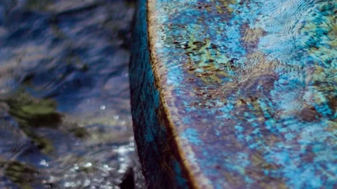 WATER FLOWING DOWN WATER FEATURE E Video stock 229614742