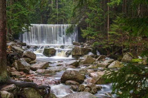 Water flowing down the waterfall Stock Photos