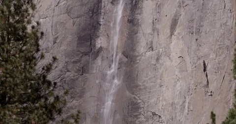 Water flowing down Yosemite falls at Yosemite National Park, California, shot Video stock 103449338