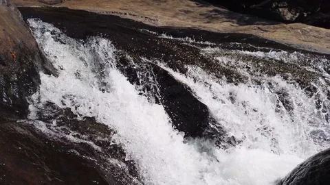 Water Flowing Downstream in mountain Stock Footage 128838352