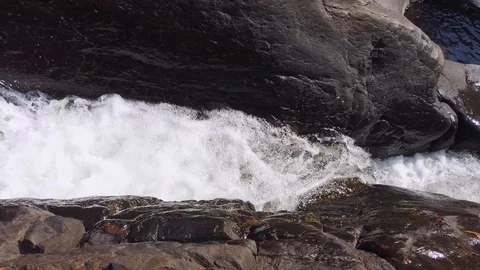 Water Flowing Downstream in mountain Stock Footage 128843762