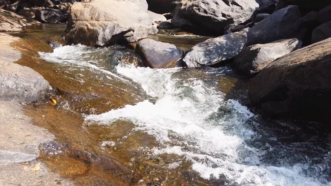 Water Flowing Downstream in mountain Stock Footage 128844390