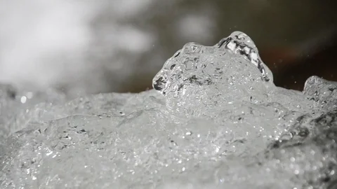 Water flowing downwards over cliffs and rocks, close up. Water splashing Stock Footage 106539420