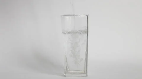 Water flowing in an empty glass Stock Footage 31707651