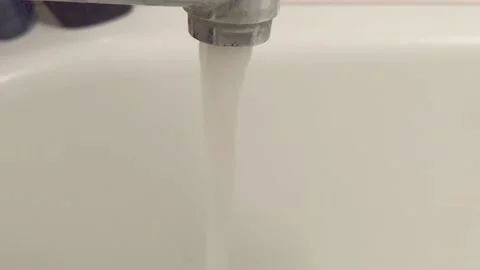 Water flowing from a faucet Stock Footage 220658213