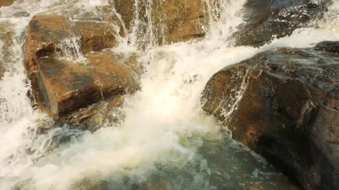 The water flowing with a good strength between the slippery lime stone Stock Footage 170013549