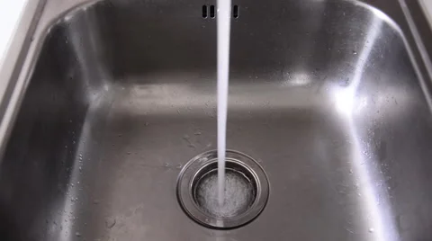 Water flowing in kitchen sink. Stock Footage 52459137