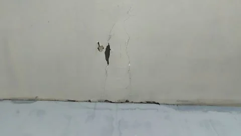 Water flowing from a leaking ceiling 스톡 동영상 288946480