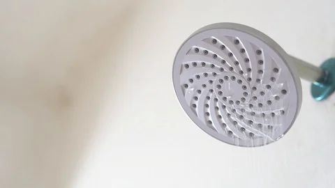 Water flowing from a leaking shower head Stock Footage 107079852