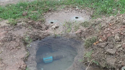 Water flowing from main pipe damage in underground. Stock Footage 78977934