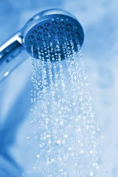 Water flowing from metal shower Stock Photos