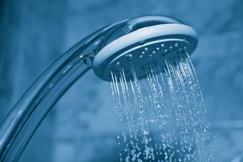 Water flowing from metal shower Stock Photos