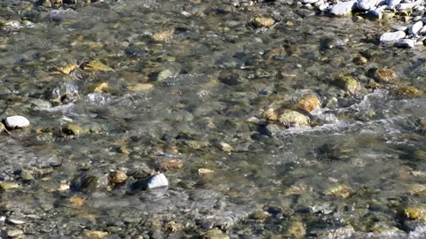 Water flowing in the mountain stream. Slow motion 4K Video stock 166461153